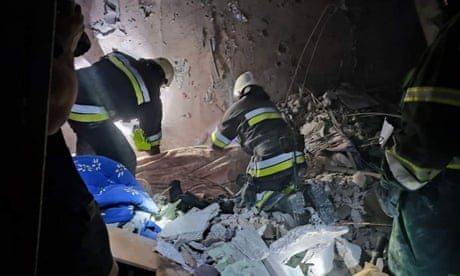 Emergency crew work to recover people from the wreckage after Russian missiles strike a multi-storey apartment building in Odesa, Ukraine.