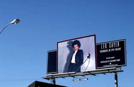 A Leo Sayer billboard for Thunder In My Heart on the Sunset Strip, circa 1977, against a blue sky.