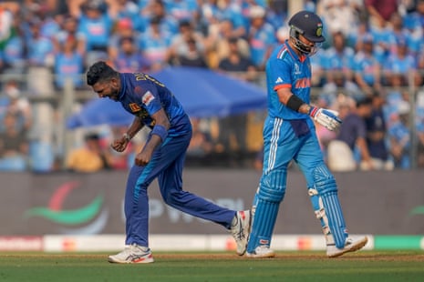 Virat Kohli walks after losing his wicket.