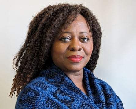 Olivette Otele in a blue cardigan.