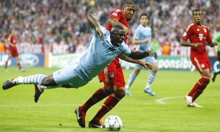 Micah Richards takes flight after a challenge with Bayern Munich’s Jérôme Boateng during a 2011 Champions League match