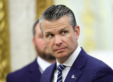 a man in a suit looks off to the side