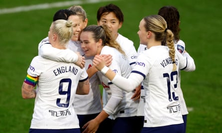 Tottenham players celebrate Bethany England’s stoppage-time equaliser.