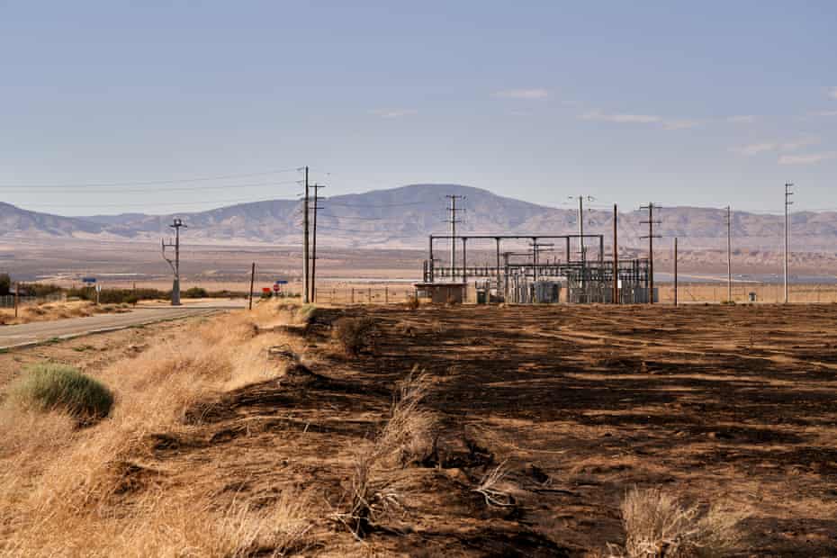 Burned grass from a wildfire near a sub-station in the town of Neenach, 10 miles east of the proposed site of Centennial.