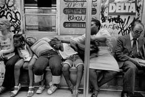 RR Train, NYC, 1982 ‘Most people assume that the three black kids are related to the black woman on the right, but that’s not the reality. The dozing kids were on the train with the white woman and I took a few pictures of that scene, first. Then the woman on the right got on the train, saw me making a picture, was angered by that and tried to block their faces from my camera’