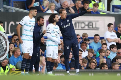 Chelsea manager Thomas Tuchel gives instructions to Marc Cucurella and Armando Broja before they come on as substitutes.