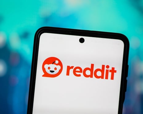 The Reddit logo is seen displayed on a smartphone screen