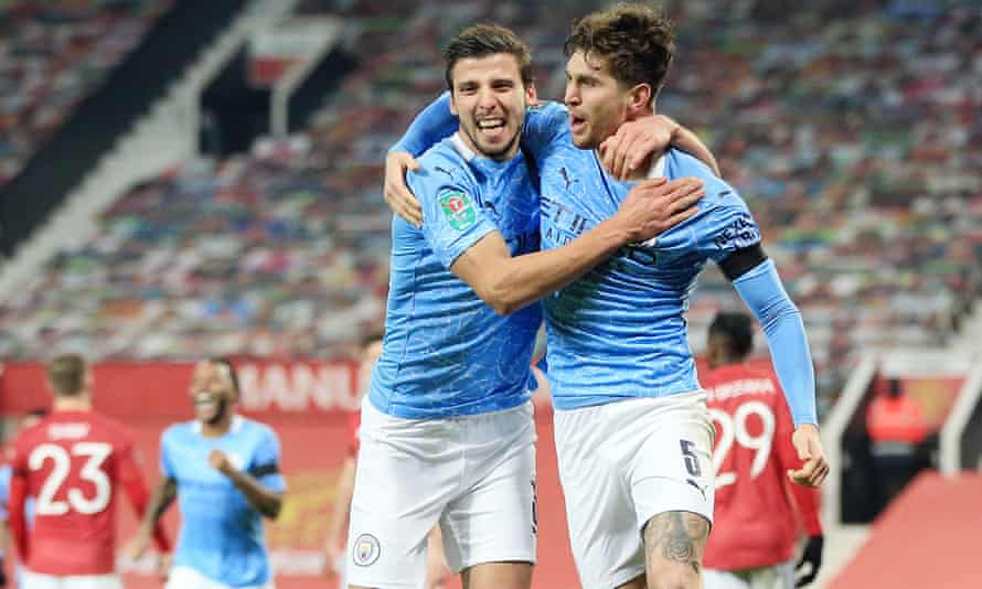 Stones (right) and Ruben Dias (left) have formed a strong partnership at Manchester City.