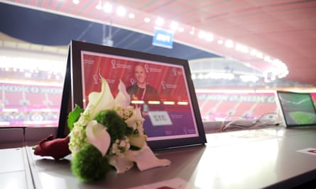 Flowers are placed in memory of Grant Wahl prior to the World Cup quarter-final between England and France