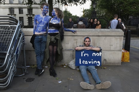 A young couple painted as EU flags protest on outside Downing Street against the United Kingdom’s decision to leave the EU following the referendum on June 24, 2016