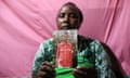 Rose Wanyua holding a photo of Agnes Wanyua