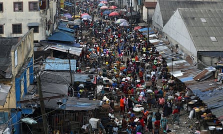 Shoppers return to a marketplace as Lagos eases the curfew imposed after protests