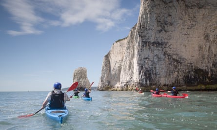 Sea kayaking, Dorset coast, UK.