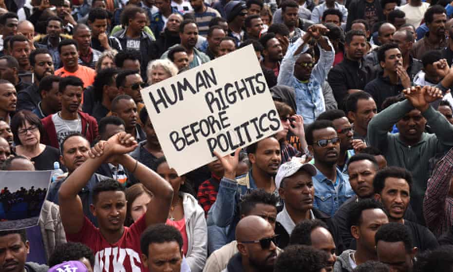 People from Sudan and Eritrea protest outside the Rwandan embassy in Herzliya, Israel