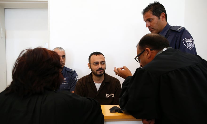 Waheed al-Borsh, a UN Development Programme employee in Gaza accused of aiding Hamas, speaks to his lawyers at Beersheva district court in 2016.