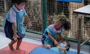 Children play at Makkasan preschool in Bangkok, Thailand, as schools reopen.