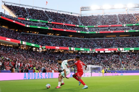 Rayan Ait-Nouri Algeria is challenged by Abdallah Nasib of Jordan in front of a big crowd