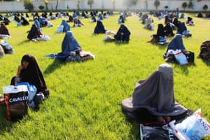Women receive a free food ration in Kandahar.