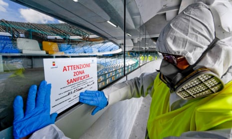 Operators sanitise the San Paolo stadium in Naples to prevent the spread of coronavirus.