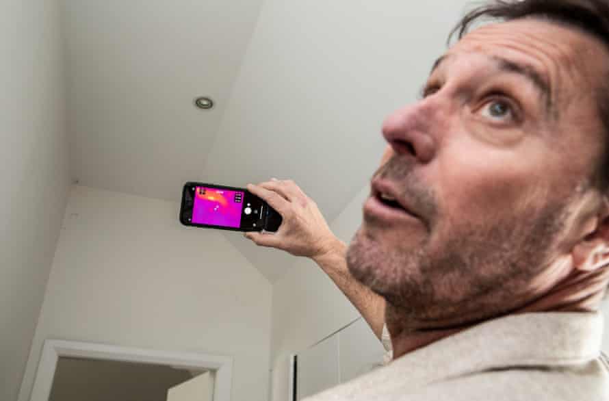 Energy assessor Adam Corrigan takes thermal images of the ceiling to see if there are any gaps in the ceiling insulation