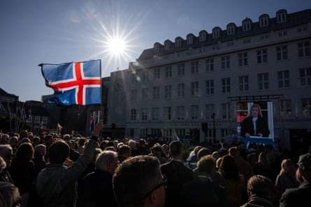 A participant waves an Icelandic flag during a rally of supporters of the ‘No’ campaign against reopening Iceland’s EU accession