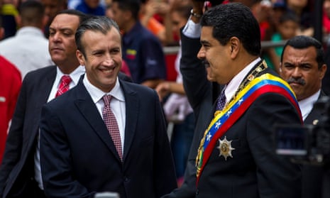 Vice-president Tareck El Aissami, left, shakes hands with President Nicolás Maduro in Caracas on 15 January.