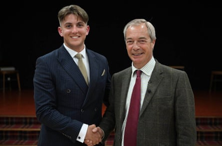 George Finch shaking hands with Nigel Farage.