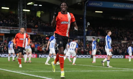 Elijah Adebayo celebrates after scoring Luton’s fourth goal against Brighton