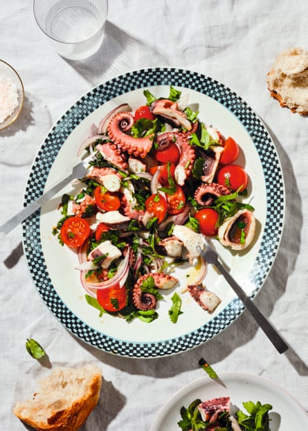 Topview of a plate of octopus and tomato salad