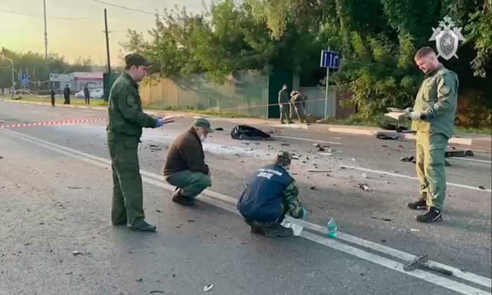 Investigators working at the scene of a car explosion on Mozhaisk highway in the Moscow region, Russia.