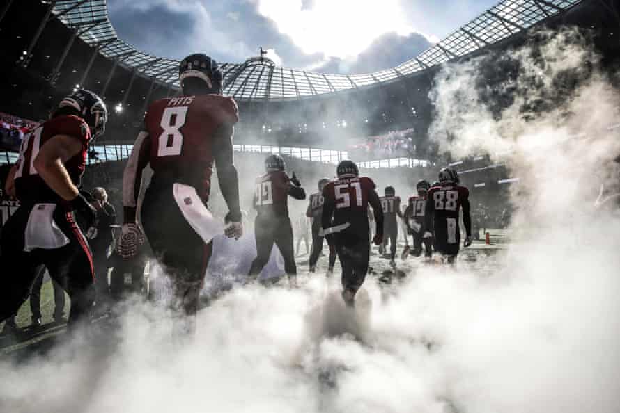 The Falcons offense run onto the pitch for kick off during the NFL London 2021 match between New York Jets and Atlanta Falcons at the Tottenham Hotspur Stadium on October 10th, 2021.