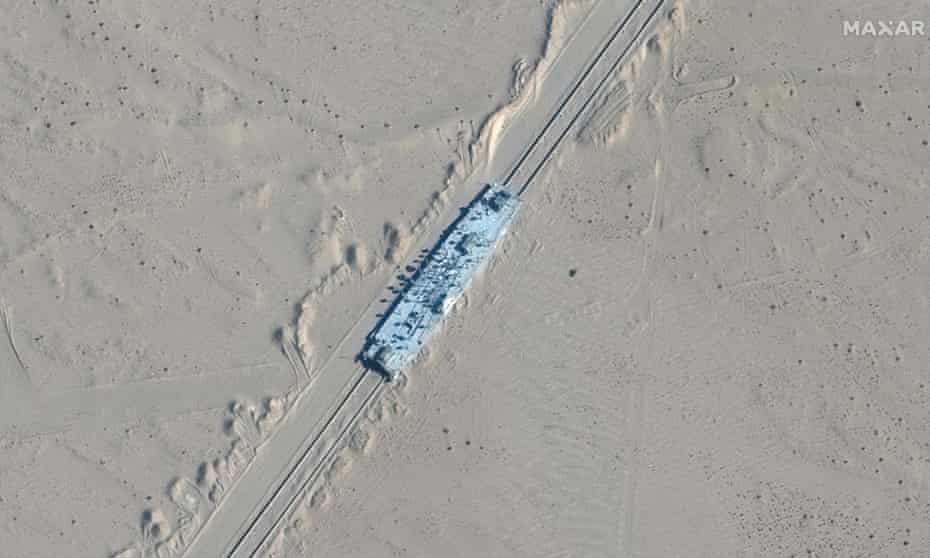 Satellite images show China has built mock-ups of US warships | China | The Guardian