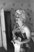 Marilyn Monroe using Chanel No 5 perfume, March 1955.