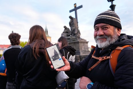 Jorge Sanchez holds his phone to the camera showing the Depeche Mode photo.