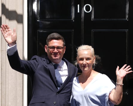 Andy Burnham and his wife Marie-France van Heel wave outside No 10
