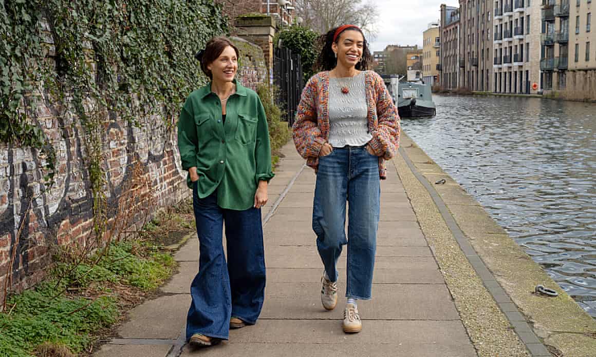 Morwenna Ferrier and Emma Loffhagen walk along a canal towpath