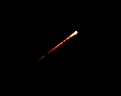 A flare trail of an interceptor missile launched from Israeli air defences over the sky of Jerusalem on Sunday night