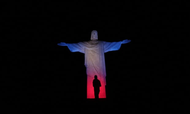 The Christ the Redeemer statue is illuminated in Rio de Janeiro.