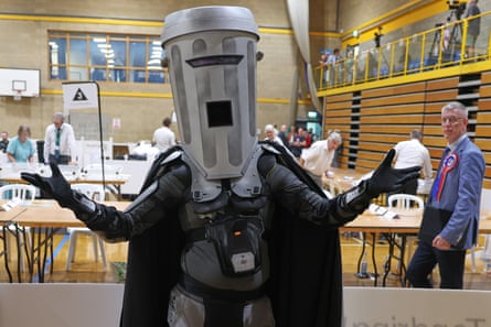 a man with a plastic bin on his head