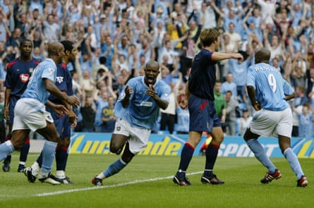 David Sommeil celebrates scoring a last-minute equaliser against Portsmouth successful nan first convention crippled astatine nan City of Manchester Stadium successful 2003