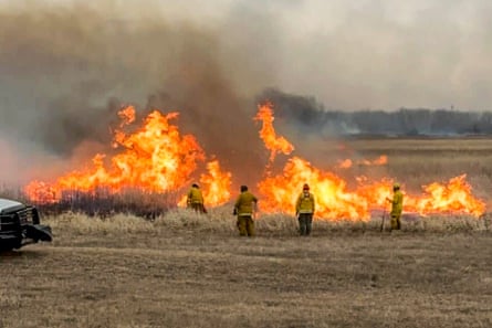 Firefighters respond to a wildfire in Western Township, Minnesota, on 3 March 2024.