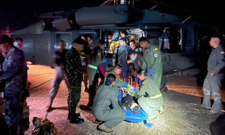 Members of the Colombian army checking one of the four children before transporting them to hospital.