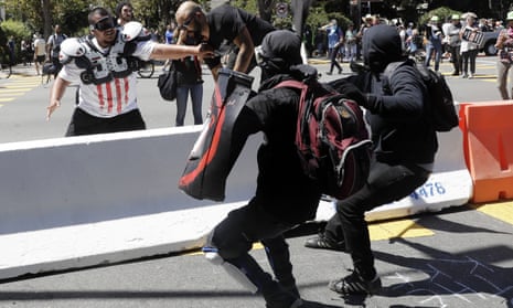 Anti-fascist protesters and a rightwing demonstrator at a rally in Berkeley.