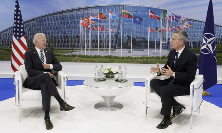 Joe Biden and the Nato secretary general, Jens Stoltenberg, meet during the summit in Brussels