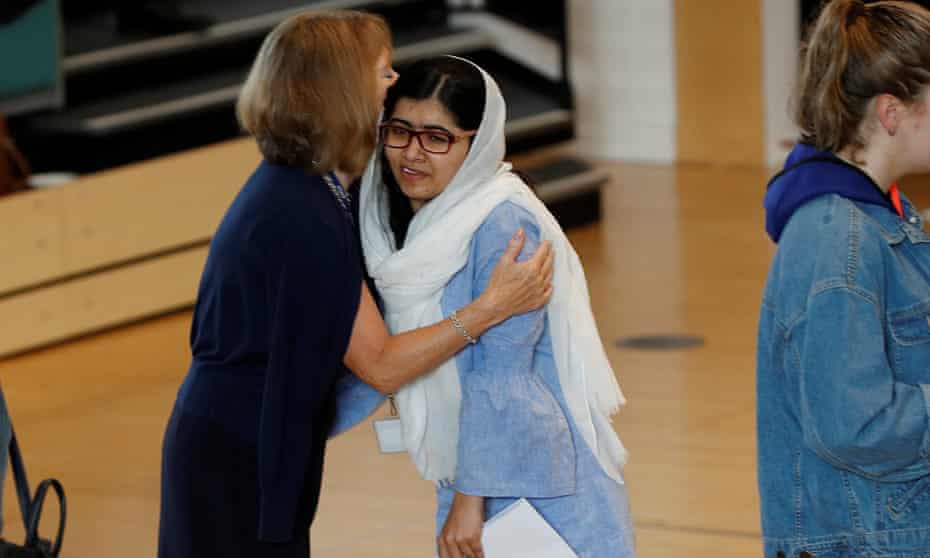 Malala Yousafzai is congratulated after collecting her A-level results at Edgbaston high school for girls in Birmingham.