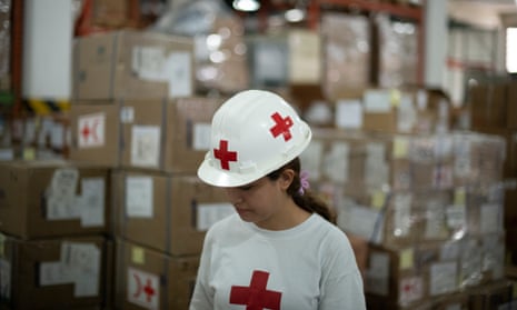 A Red Cross volunteer works in an International Committee of the Red Cross warehouse in Caracas, Venezuela