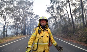 Volunteer firefighter Gary Stokes monitors bushfires close to a residential area in Dargan, 120km from Sydney.