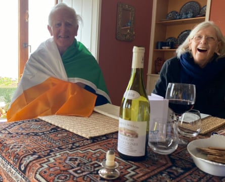 John le Carré wrapped in an Irish flag, beside his wife, 19 October 2020, his 89th birthday