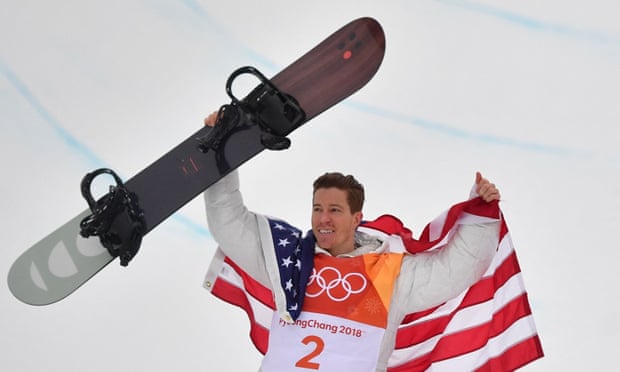 Shaun White celebrates on the podium after winning gold in the men's snowboard halfpipe at the Pyeongchang 2018 Winter Olympics.