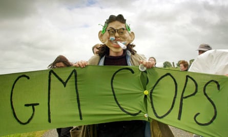 protester with a banner saying: GM crops